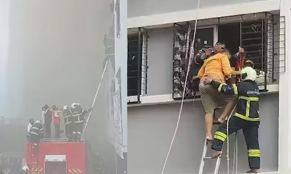 অগ্নিকাণ্ড ঘটা বহুতল ভবন থেকে আটকে পড়া মানুষদের উদ্ধার করা হচ্ছে। ছবি- সংগৃহীত