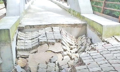 নির্মাণাধীন ব্রিজের  এপ্রোচ সড়কে ধস