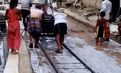 বৃষ্টির পানিতে রাস্তার ঢালেইয়ে ক্ষুব্ধ জনতা