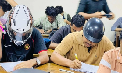হেলমেট পরে কেন পরীক্ষায় বসলেন শিক্ষার্থীরা