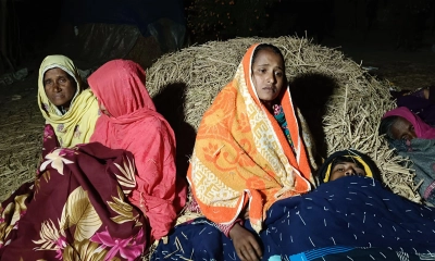 খড়ের গাদার পাশে শুয়ে আছে সাজিদের পরিবার।  ছবি- সংগৃহীত