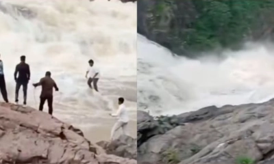 ওড়িশার দুদুমা ঝরনায় স্রোতের মাঝে আটকে যাওয়ার সময় ইউটিউবার সাগর তুডুকে উদ্ধারের চেষ্টা চালাচ্ছিলেন পর্যটকরা। ছবি- সংগৃহীত
