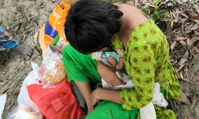 মহাসড়কের পাশে পাগলির কোলে ফুটফুটে নবজাতক