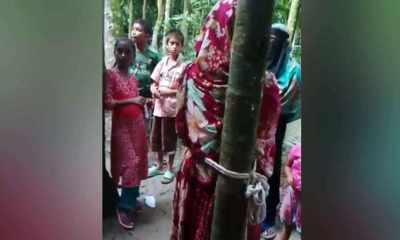 মধ্যরাতে বাড়ির উঠানে গাছের সঙ্গে বেঁধে মারধর ।  ছবি - সংগৃহীত